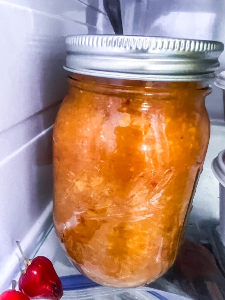 peach puree in a small 2 cup mason jar in the refrigerator