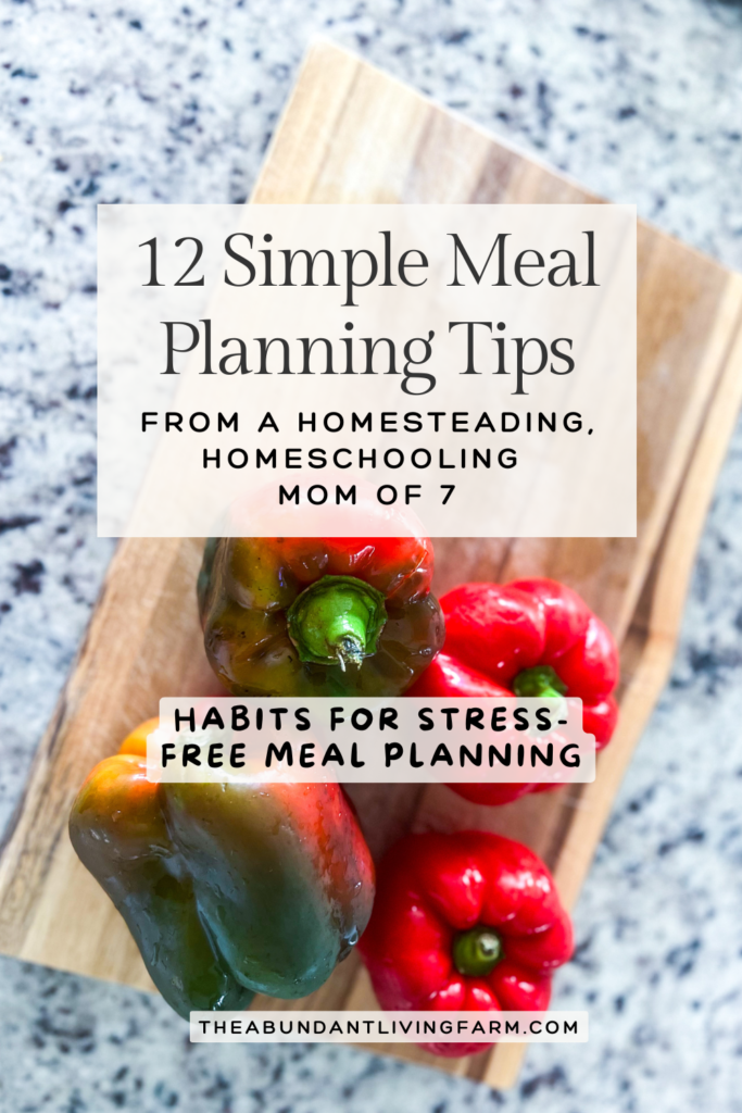 12 simple meal planning tips from a homesteading, homeschooling mom of 7 banner with a banner that says habits for stress-free meal planning over top a picture of 4 red and green colorful bell peppers on top of a wooden cutting board sitting on a granite countertop